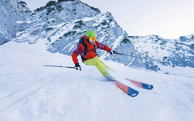 Skier turning while skiing downhill