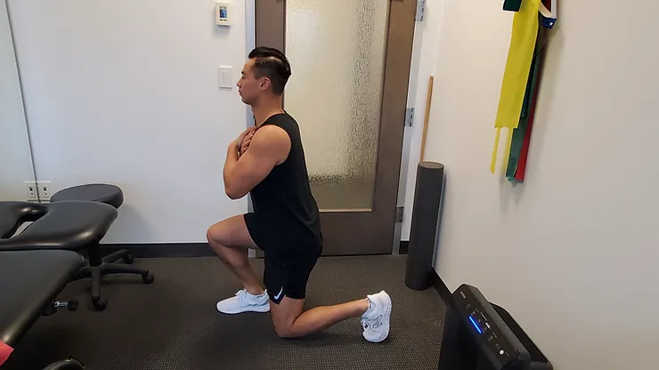 Physiotherapist Eric Lau demonstrating a lunge exercise.