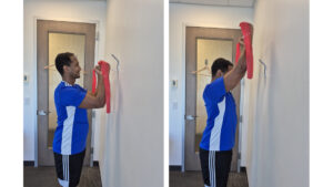 Physiotherapist Najih Ismail preforming the isometric shoulder external rotation wall slide exercise. This exercise is a rehab exercise for shoulder bursitis and shoulder tendonitis.