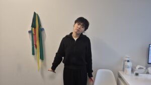 Physiotherapist Gahoi Kim preforming the median nerve glide exercise