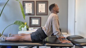 Physiotherapist Najih Ismail demonstrating a cobra stretch