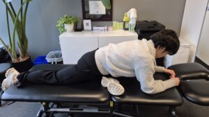 Physiotherapist Gahoi Kim demonstrating how to perform the pigeon stretch.