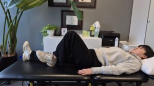 Physiotherapist Gahoi Kim demonstrating heel slide exercise