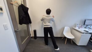 Physiotherapist Gahoi Kim demonstrating standing hip fire hydrant exercise.