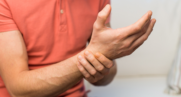 Men suffering from wrist sprain/ strain