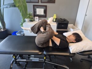 Physiotherapist Gahoi Kim performing supine piriformis stretch